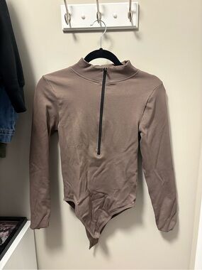 OQQ Long-Sleeve Ribbed One-Piece Bodysuit in Taupe